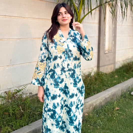 AURA This blue tie-dye stitched 2 piece outfit adorned with vibrant yellow embroidery is a beautiful expression of refined style. 